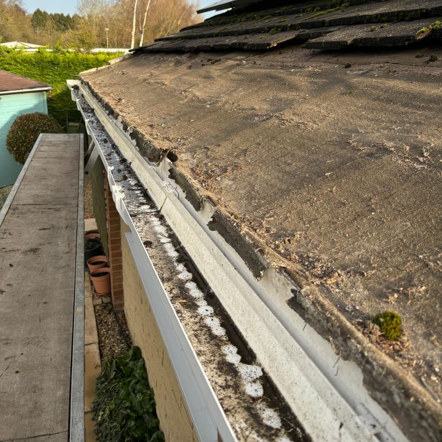 The old, worn roofline stripped back at the eaves